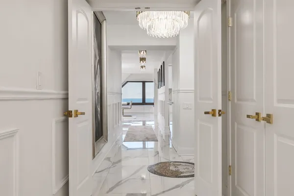 a view of a hallway with washer and dryer