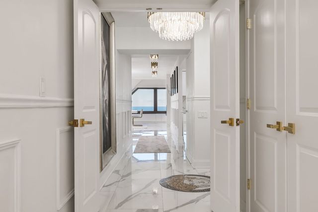 a view of a hallway with washer and dryer