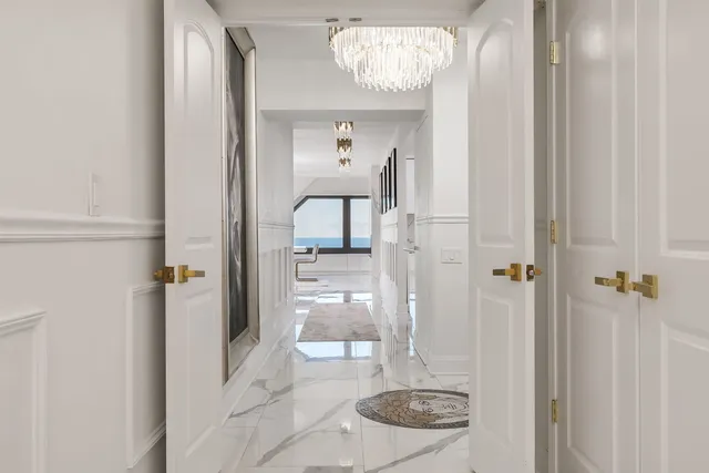 a view of a hallway with washer and dryer