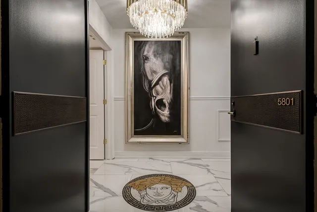 a kitchen with furniture a chandelier and a stove