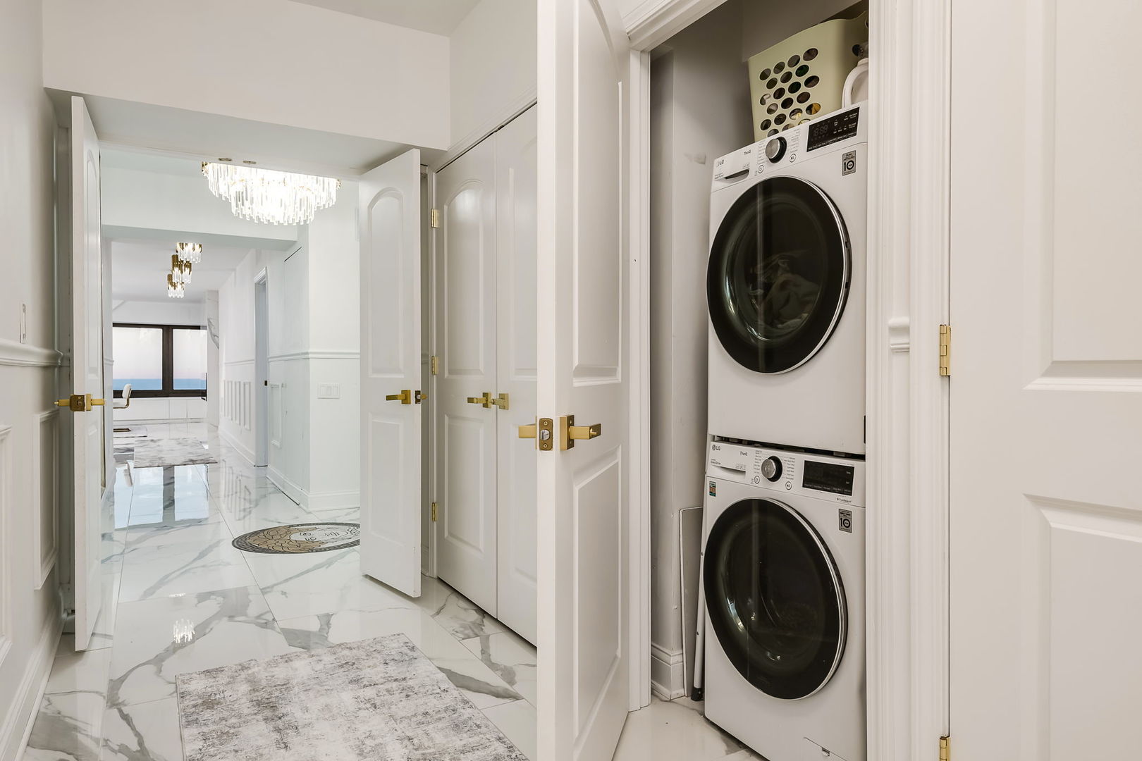 175 East Delaware Place, Unit 580102 Chicago, IL 60611 - Photo 21 of 33 a view of a hallway with washer and dryer