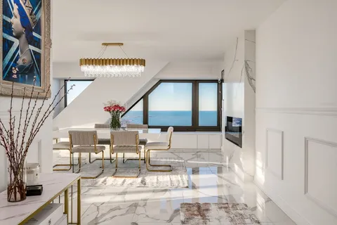 a dining room with furniture and window