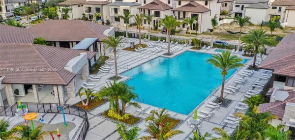 an aerial view of a house with a garden and plants