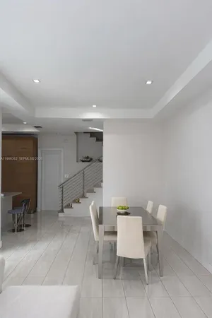 a room with a table and chairs