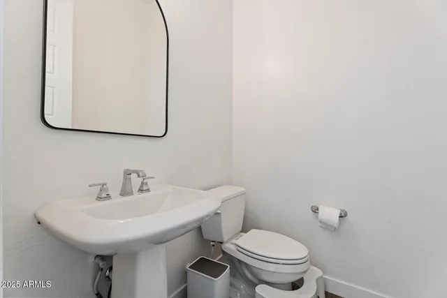 a bathroom with a sink and a toilet