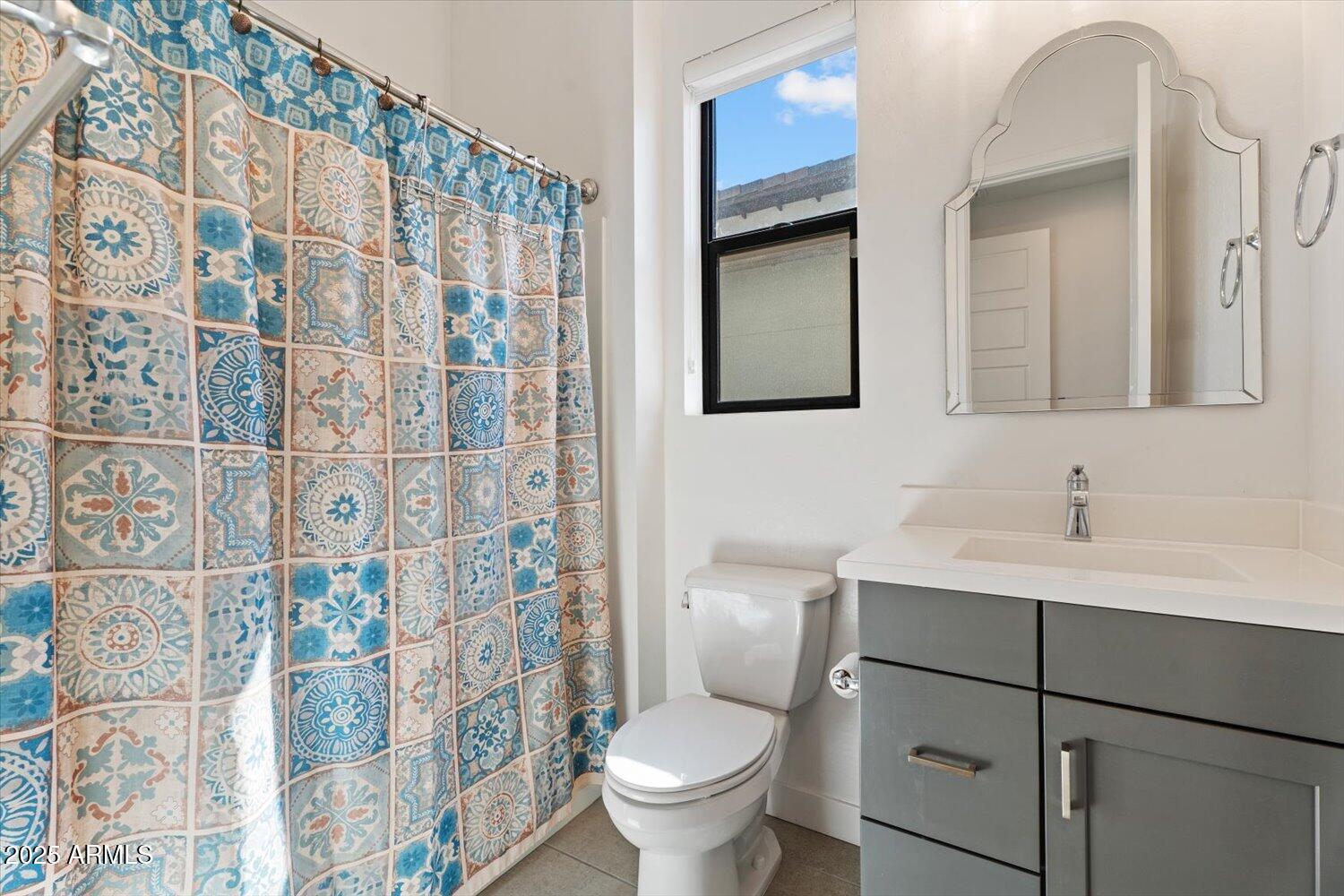 816 East Monte Way Phoenix, AZ 85042 - Photo 13 of 35 a bathroom with a sink toilet and shower