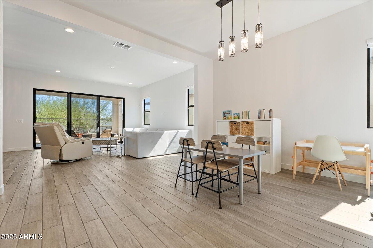816 East Monte Way Phoenix, AZ 85042 - Photo 2 of 35 a living room with furniture and a wooden floor