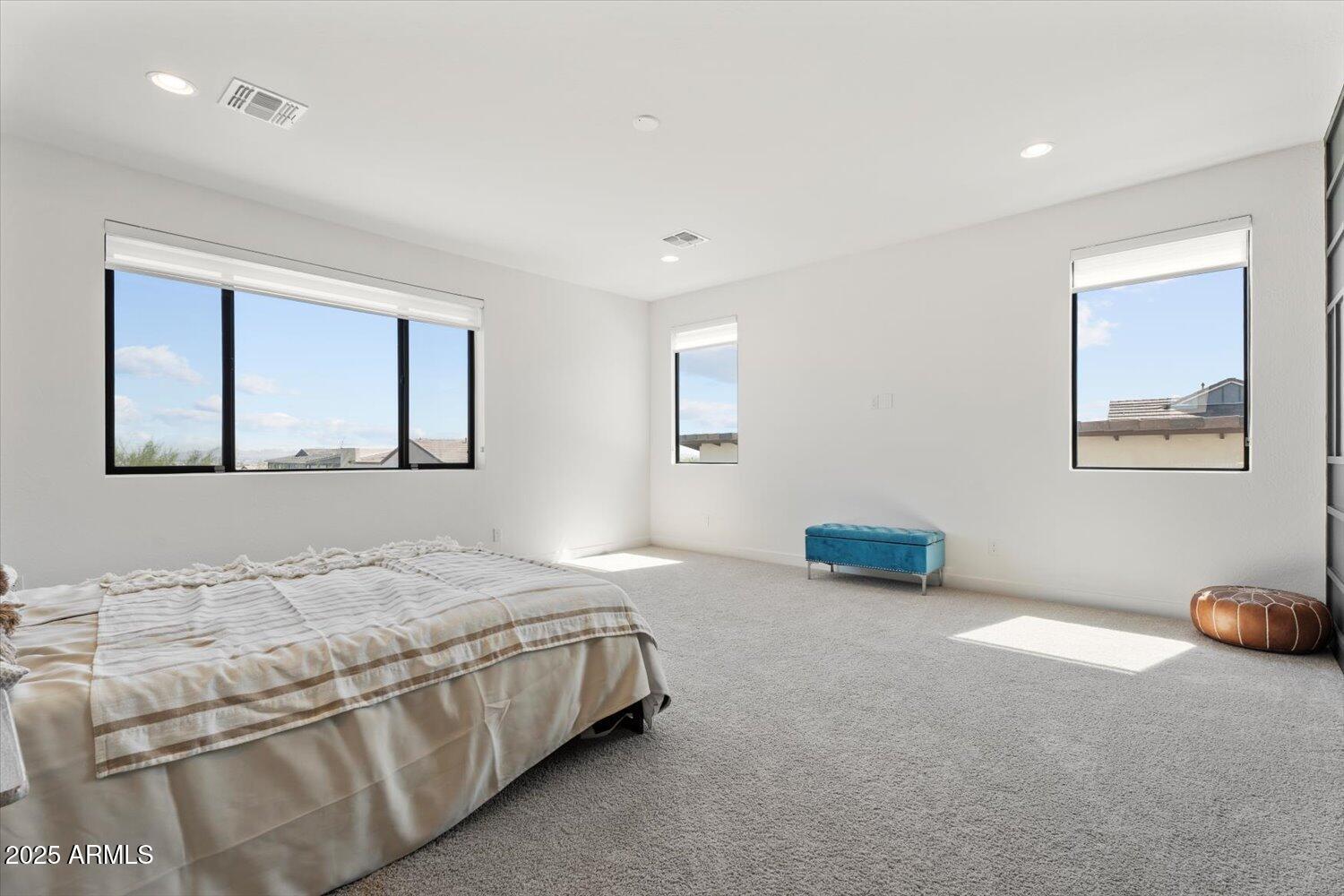 816 East Monte Way Phoenix, AZ 85042 - Photo 21 of 35 a bedroom with a bed and a painting on the wall
