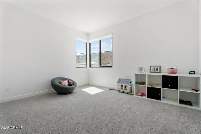 a view of workspace with furniture and window