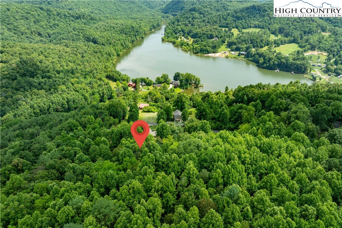 Lot 20 Lake Ridge Butler, TN 37640 - Photo 15 of 27 a backyard of a house with a yard and lake view