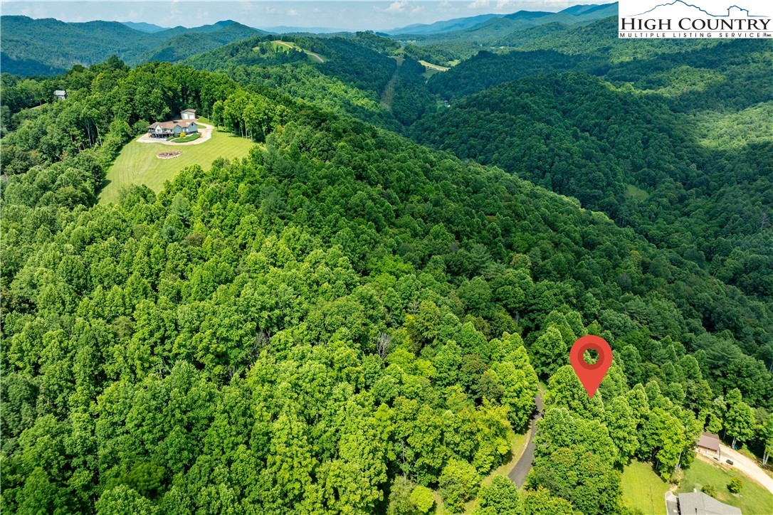 Lot 20 Lake Ridge Butler, TN 37640 - Photo 21 of 27 a backyard of a house with a yard and seating area