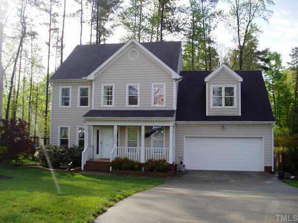 2704 Dahlgreen Road Raleigh, NC 27615 - Photo 1 of 7 a front view of a house with a garden and trees