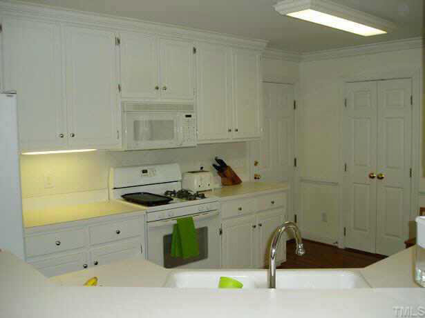 2704 Dahlgreen Road Raleigh, NC 27615 - Photo 4 of 7 a kitchen with a sink and cabinets