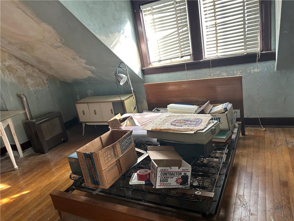 301 Meredith Street Pittsburgh, PA 15210 - Photo 21 of 30 a living room with furniture and a wooden floor