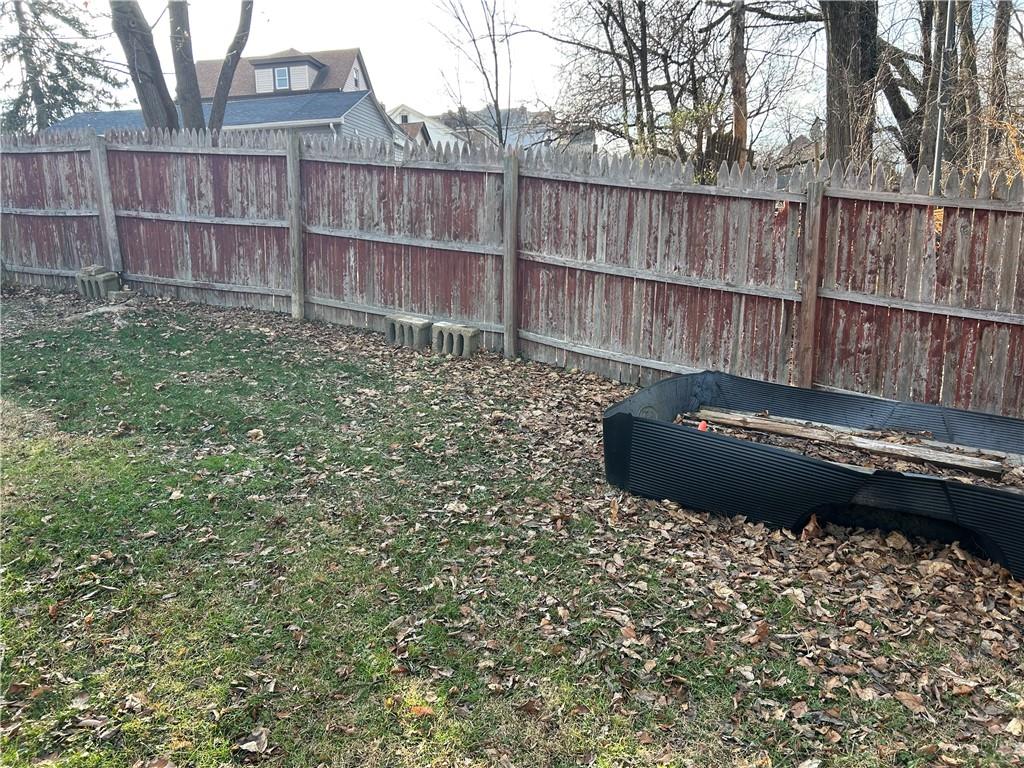 301 Meredith Street Pittsburgh, PA 15210 - Photo 25 of 30 a view of a backyard with wooden fence