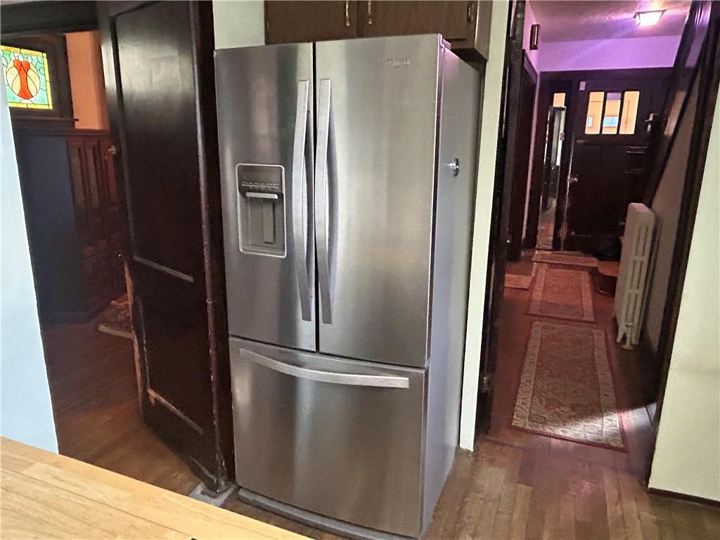 301 Meredith Street Pittsburgh, PA 15210 - Photo 6 of 30 a metallic refrigerator freezer sitting in a kitchen