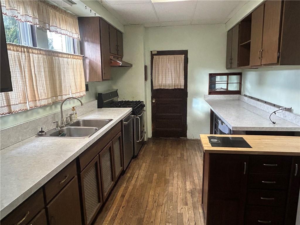 301 Meredith Street Pittsburgh, PA 15210 - Photo 7 of 30 a kitchen with a sink stove and microwave