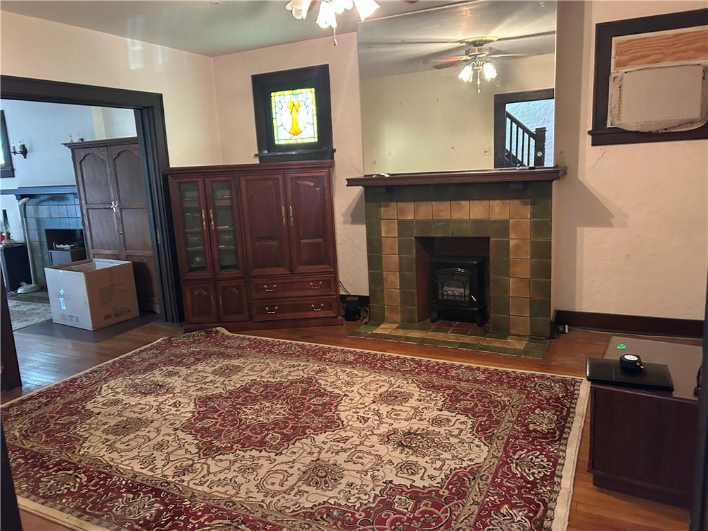 301 Meredith Street Pittsburgh, PA 15210 - Photo 8 of 30 a living room with furniture and a fireplace