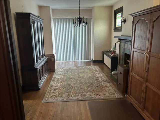 a bed room with a bed and a chair