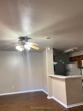a kitchen with a sink a stove and a refrigerator