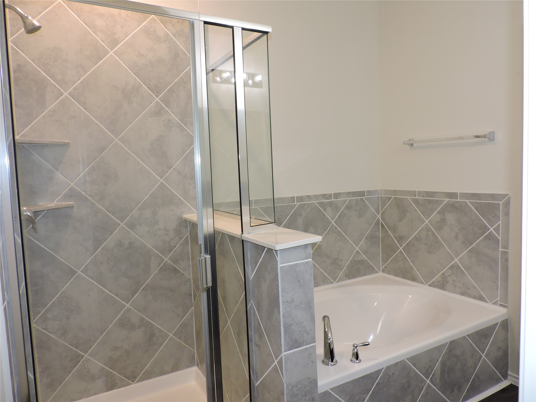 4022 Timber Sapp Drive Conroe, TX 77304 - Photo 21 of 35 Walk in Shower and Soaking Tub with Ceramic Tile surrounds