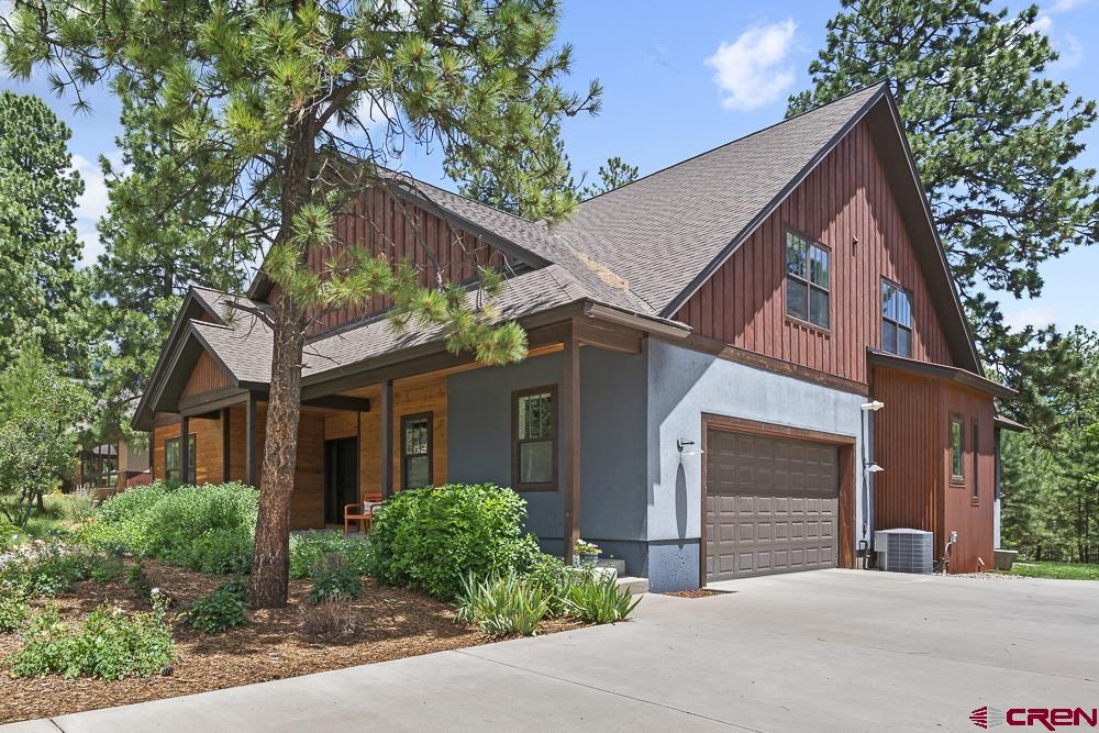 322 Window Lake Trail Durango, CO 81301 - Photo 1 of 35 a front view of house with yard and trees around