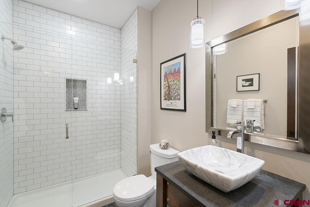 322 Window Lake Trail Durango, CO 81301 - Photo 12 of 35 a bathroom with a sink a toilet and shower