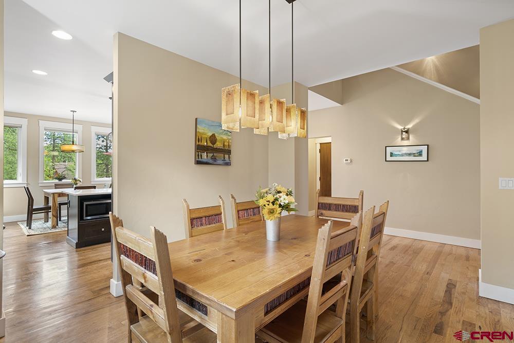 322 Window Lake Trail Durango, CO 81301 - Photo 14 of 35 a dining room with furniture a chandelier and wooden floor