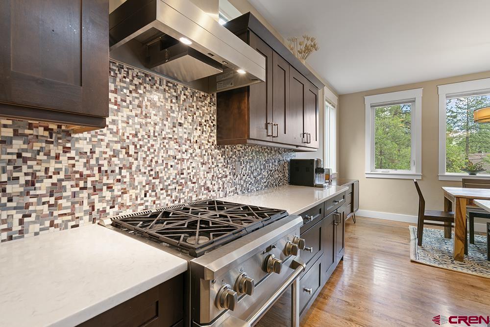 322 Window Lake Trail Durango, CO 81301 - Photo 15 of 35 a kitchen with granite countertop a stove a sink and a microwave