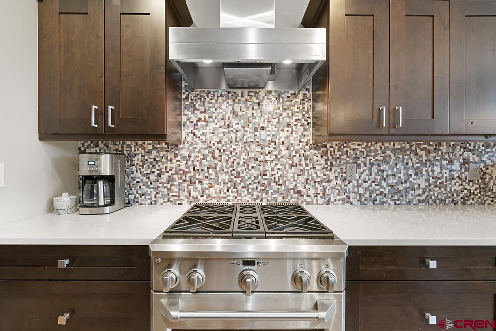 322 Window Lake Trail Durango, CO 81301 - Photo 16 of 35 a stove top oven sitting inside of a kitchen