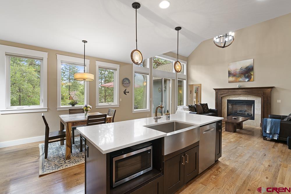 322 Window Lake Trail Durango, CO 81301 - Photo 17 of 35 a view of a kitchen with a sink a stove and a wooden floor