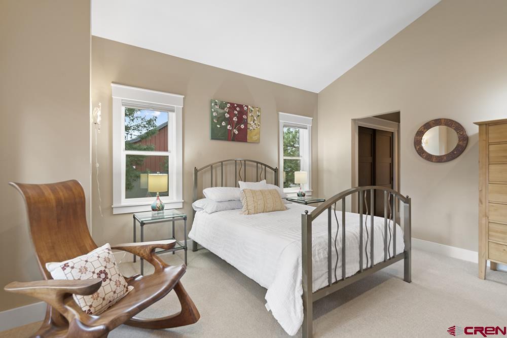 322 Window Lake Trail Durango, CO 81301 - Photo 25 of 35 a bedroom with a bed a couch and dresser