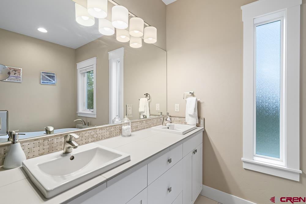 322 Window Lake Trail Durango, CO 81301 - Photo 28 of 35 a bathroom with a sink vanity and a mirror
