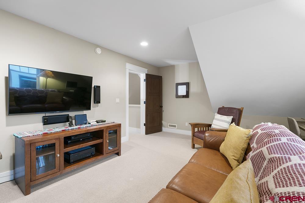 322 Window Lake Trail Durango, CO 81301 - Photo 30 of 35 a living room with furniture and a flat screen tv