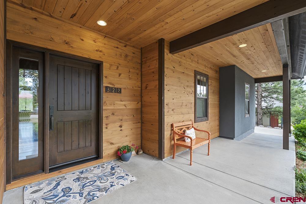322 Window Lake Trail Durango, CO 81301 - Photo 3 of 35 a view of a porch with a table and chairs
