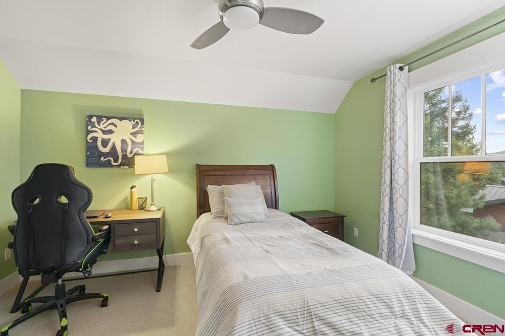 322 Window Lake Trail Durango, CO 81301 - Photo 35 of 35 a bedroom with a bed and a chair