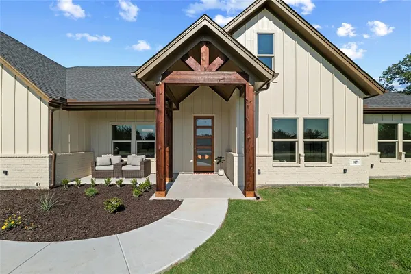 a front view of a house with a yard