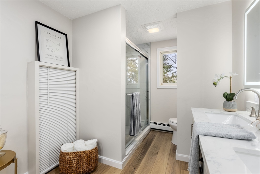 6 Henry Road Webster, MA 01570 - Photo 17 of 39 a room with furniture and a potted plant