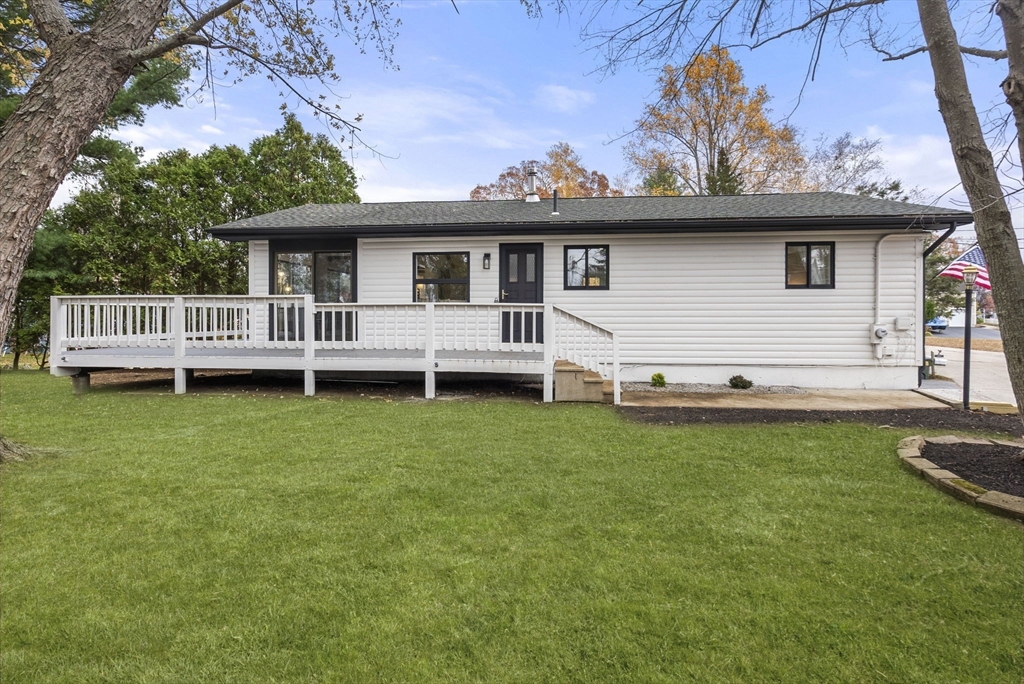 6 Henry Road Webster, MA 01570 - Photo 2 of 39 a view of a yard with a house in the background