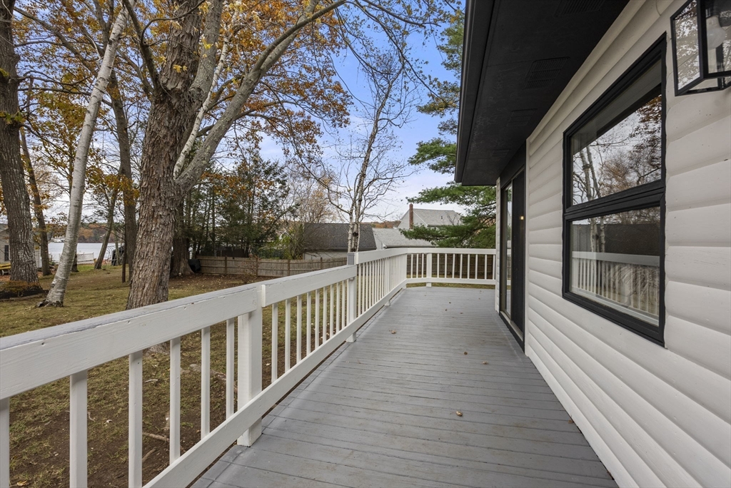 6 Henry Road Webster, MA 01570 - Photo 27 of 39 a view of a balcony with wooden floor and fence