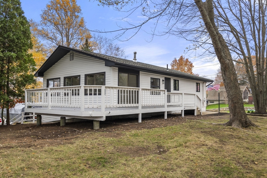 6 Henry Road Webster, MA 01570 - Photo 31 of 39 a house that has a wooden deck