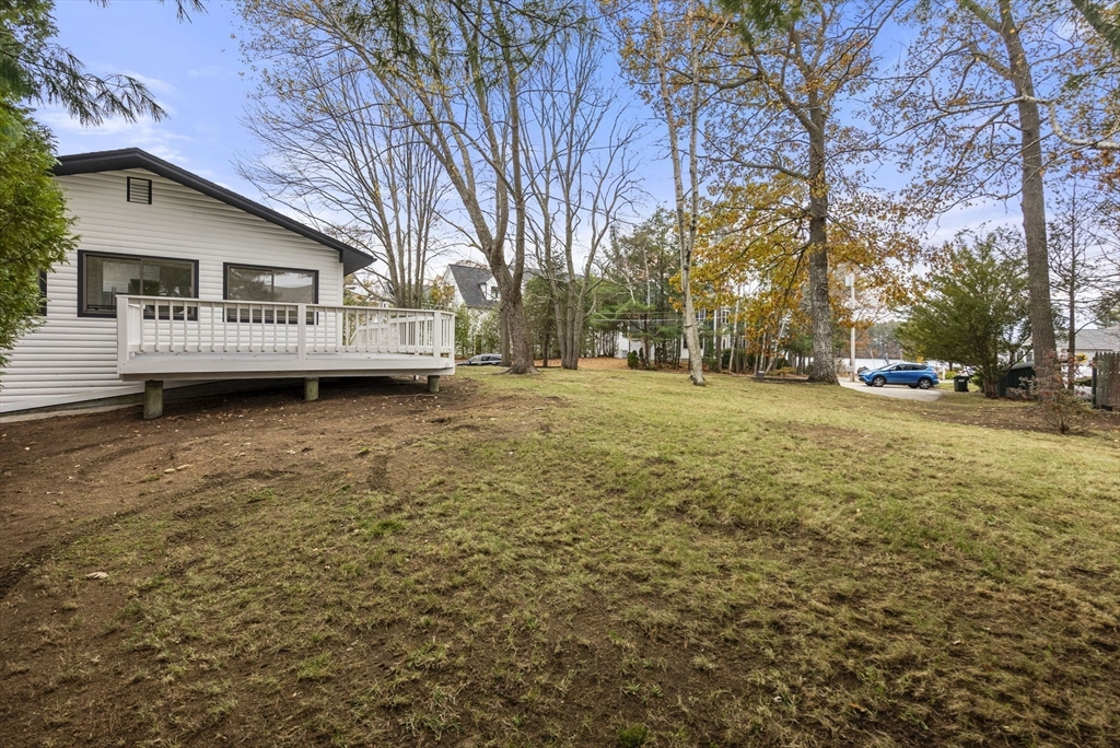 6 Henry Road Webster, MA 01570 - Photo 32 of 39 a front view of a house with a yard and garage
