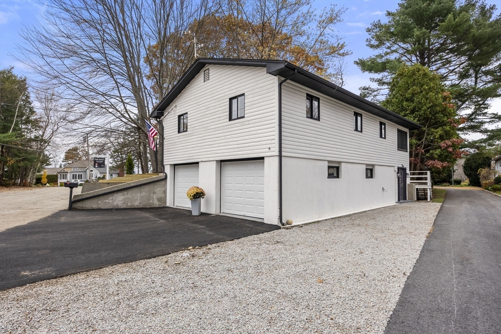6 Henry Road Webster, MA 01570 - Photo 35 of 39 a view of a white house with a large tree