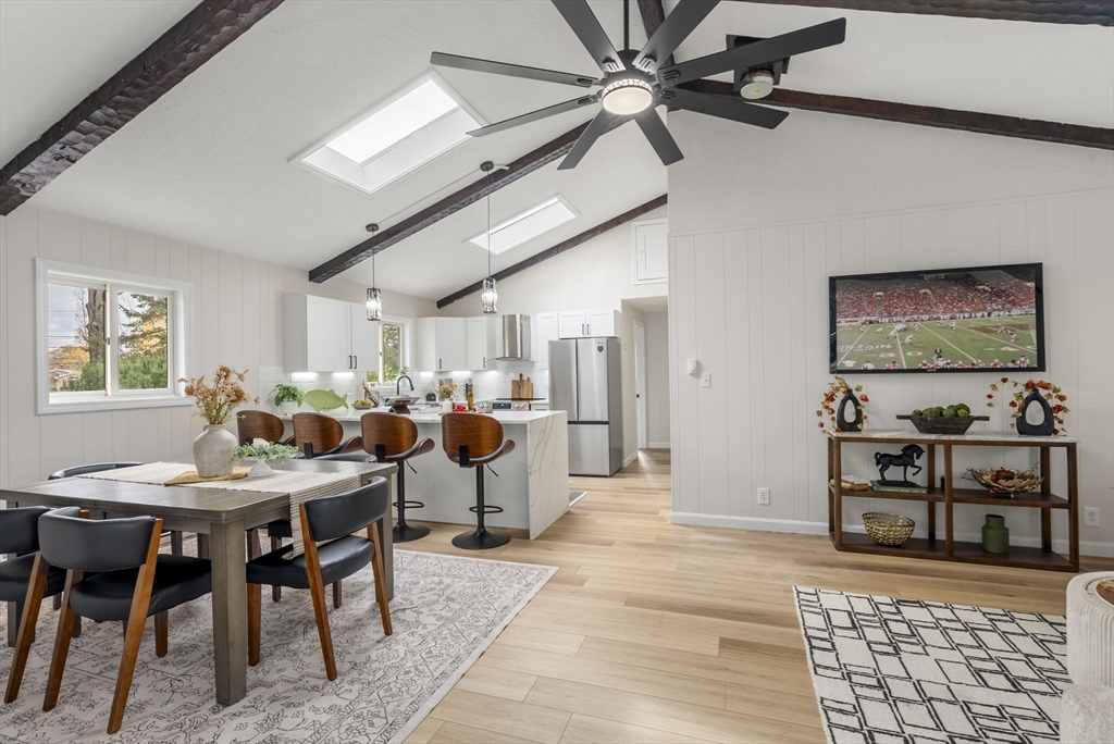 6 Henry Road Webster, MA 01570 - Photo 7 of 39 a group of people sitting in a living room