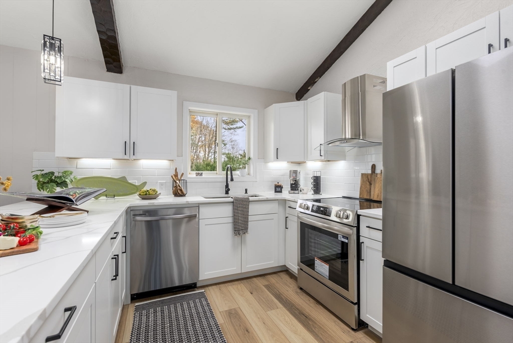 6 Henry Road Webster, MA 01570 - Photo 9 of 39 a kitchen with a sink stove and refrigerator