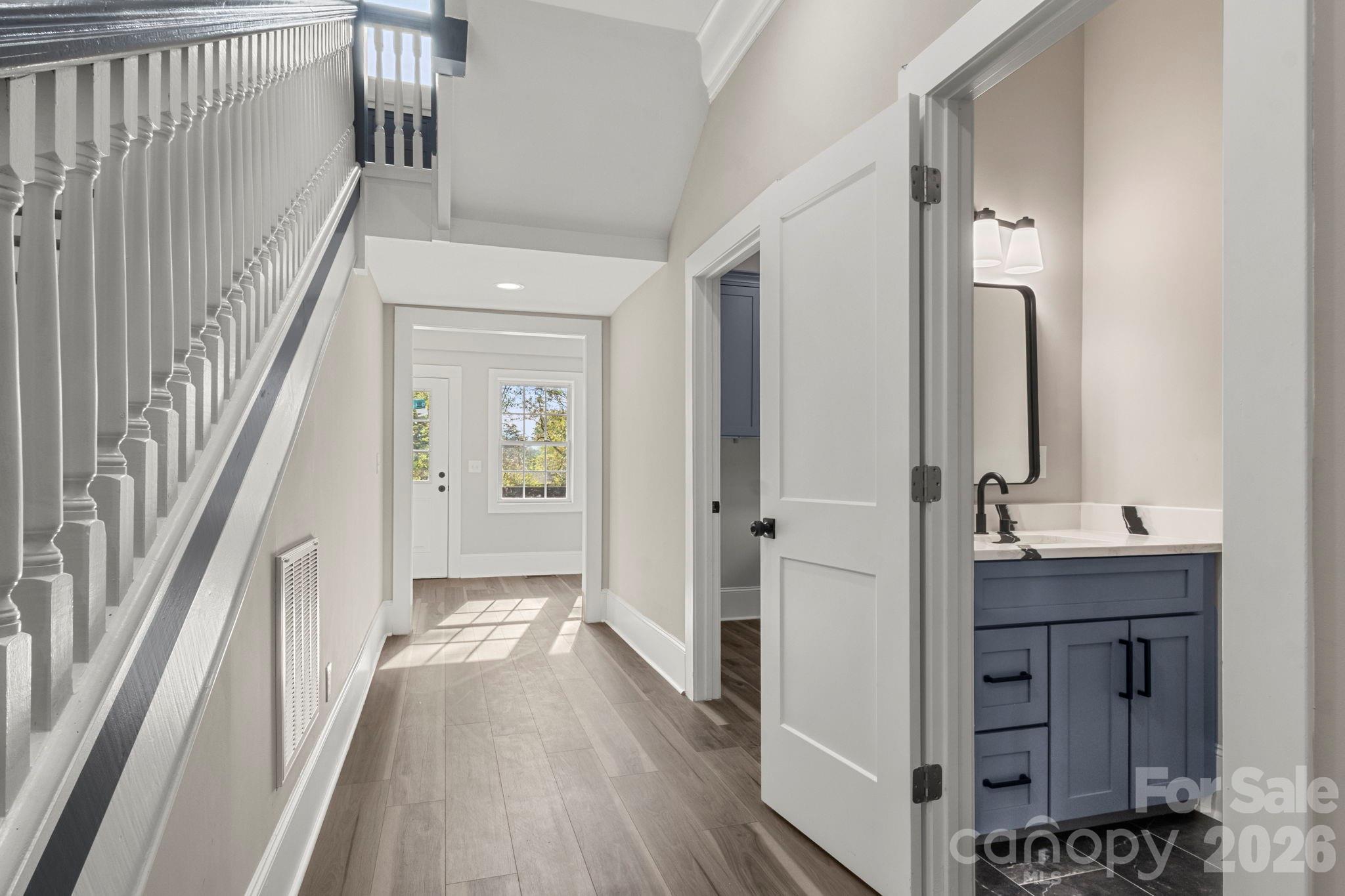 918 North New Hope Road Gastonia, NC 28054 - Photo 13 of 37 a view of a hallway with wooden floor and staircase