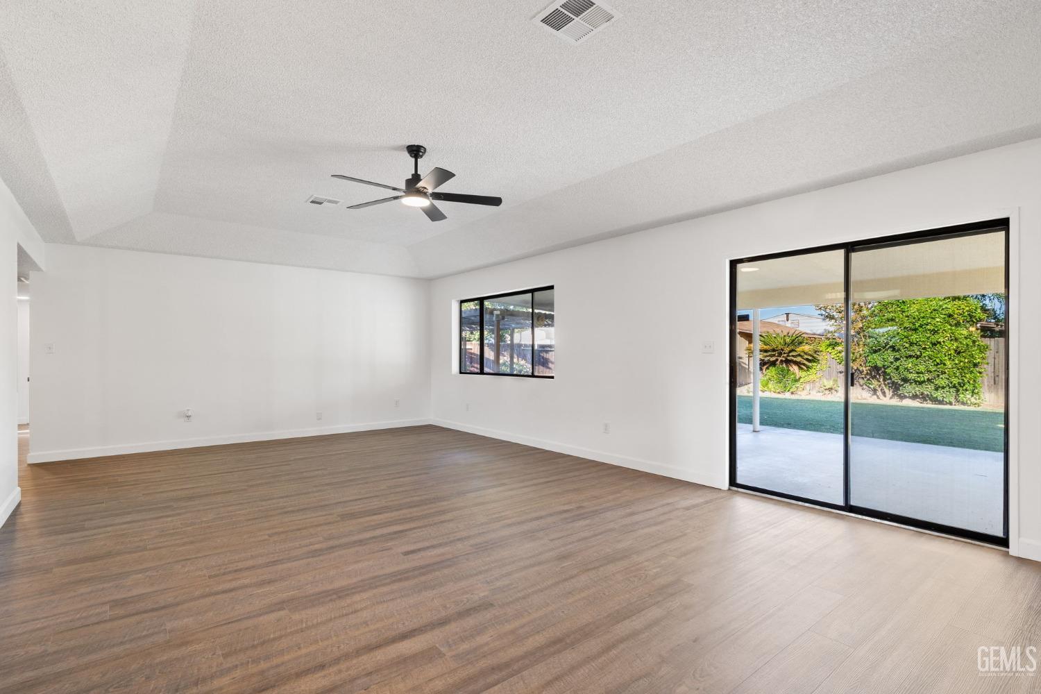 Undisclosed Address Bakersfield, CA 93314 - Photo 17 of 60 an empty room with fan and windows