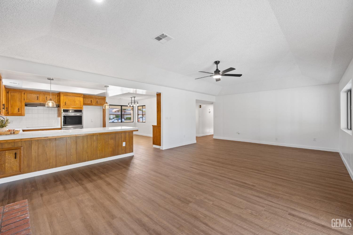 Undisclosed Address Bakersfield, CA 93314 - Photo 20 of 60 a view of a kitchen with a sink and a large window