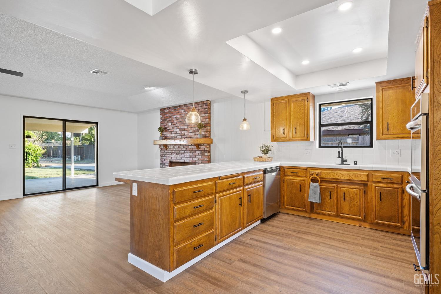 Undisclosed Address Bakersfield, CA 93314 - Photo 26 of 60 a kitchen with stainless steel appliances granite countertop a stove and a sink