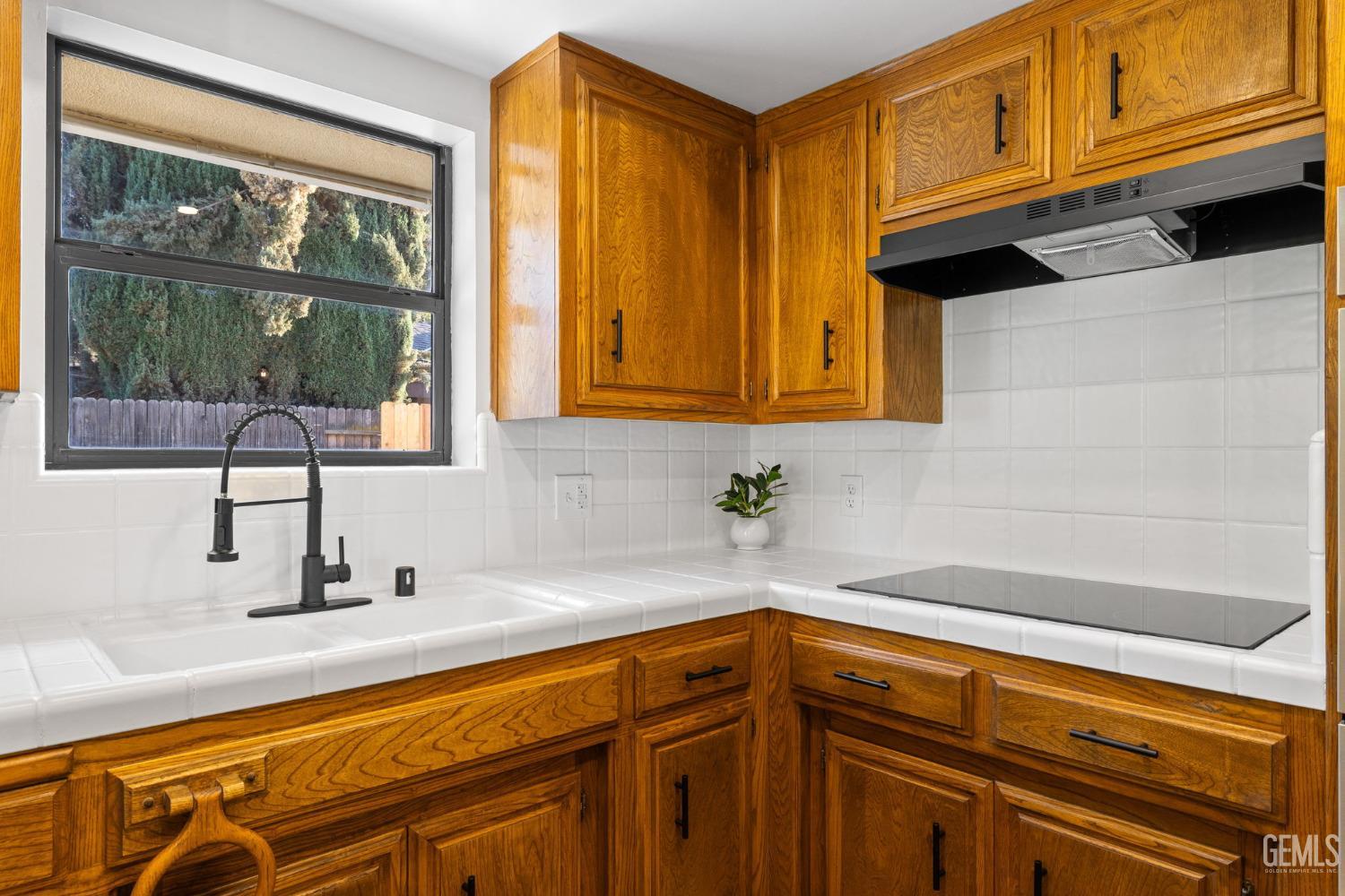 Undisclosed Address Bakersfield, CA 93314 - Photo 29 of 60 a kitchen with stainless steel appliances granite countertop a sink and cabinets